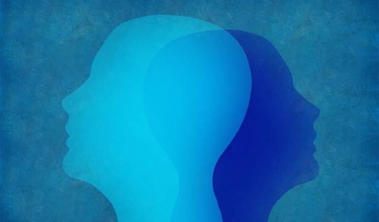 A blue-toned abstract image showing two superimposed human profiles.